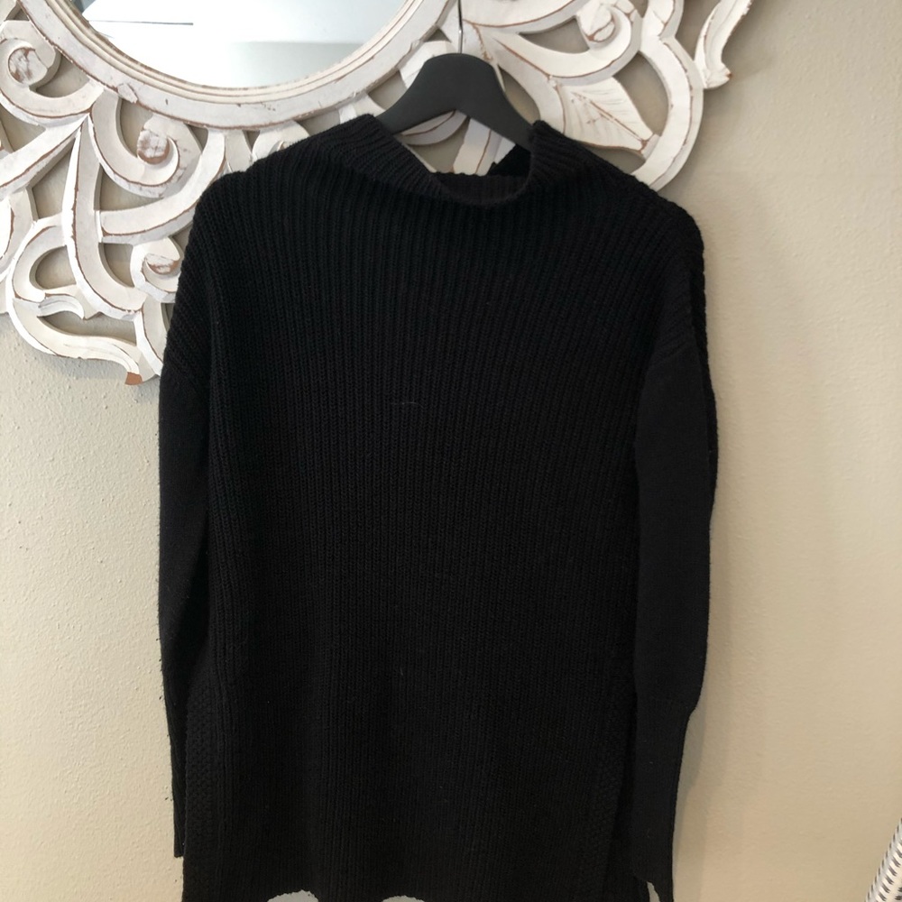 Black sweater with slit details on the sides